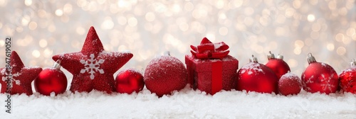 Festive Red Ornaments on Snow with Sparkling Bokeh Background