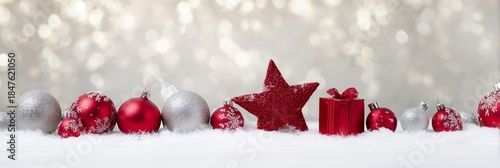 Festive Red Ornaments on Snow with Sparkling Bokeh Background