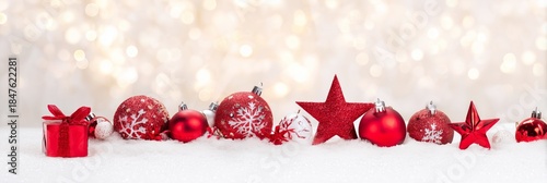 Festive Red Ornaments on Snow with Sparkling Bokeh Background
