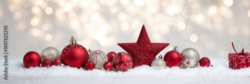 Festive Red Ornaments on Snow with Sparkling Bokeh Background