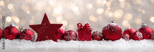Festive Red Ornaments on Snow with Sparkling Bokeh Background