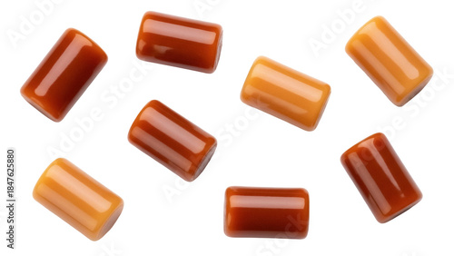 Isolated assortment of chewy rectangular caramel candies for a sweet, sugary confectionery snack