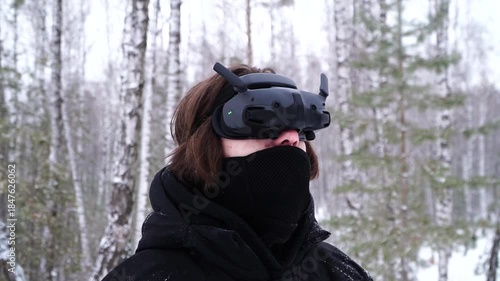 pilot controlling fpv drone through googles