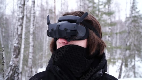 pilot controlling fpv drone through googles