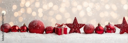 Festive Red Ornaments on Snow with Sparkling Bokeh Background