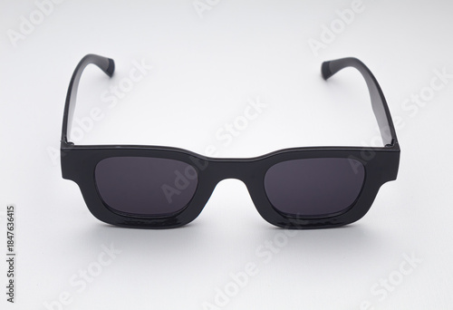 Trendy Black Sunglasses with Dark Lenses Isolated on White Background