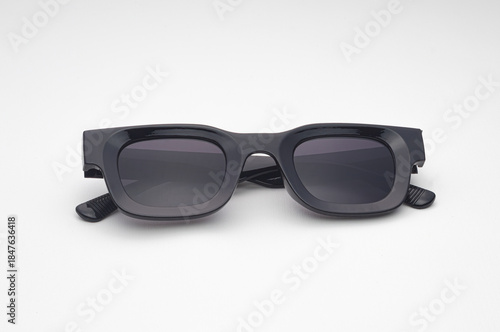 Trendy Black Sunglasses with Dark Lenses Isolated on White Background