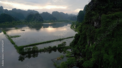 Asia, Ninh Bình and Tam Coc  in the Red River Delta region of Vietnam -  limestone karst formations emerge from rice paddies and rivers 