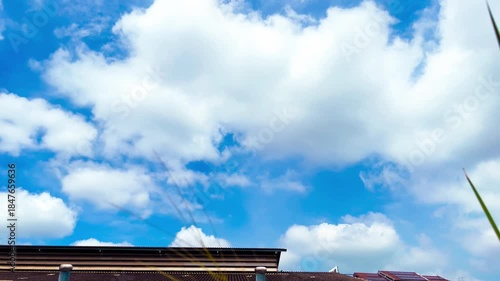 Technology and Environment, Roof Ventilators on the Roof of Market, Solar Panels on Sloped Roof on Cloudy Blue Sky Background at Bangkok, Thailand. 06 SEP 2025, A.M./ Real Time Video