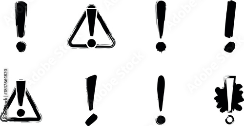 Collection of eight black brushstyle exclamation points and warning signs