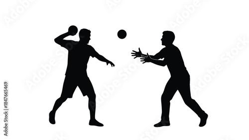 Silhouette of two men playing catch with a ball in dynamic action 