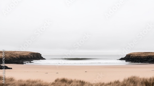 Fototapeta Naklejka Na Ścianę i Meble -  A beach with a calm sea and a cloudy sky.