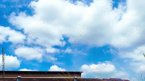 Technology and Environment, Roof Ventilators on the Roof of Market, Solar Panels on Sloped Roof on Cloudy Blue Sky Background at Bangkok, Thailand. 06 SEP 2025, A.M./ Speed Up Video