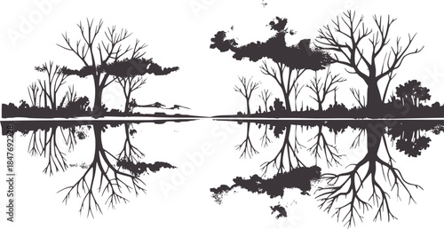 Monochrome symmetrical landscape reflection with bare trees and roots