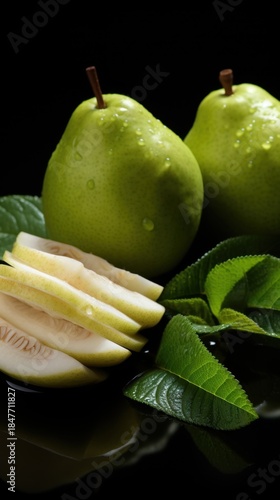 Fresh green pears on dark surface