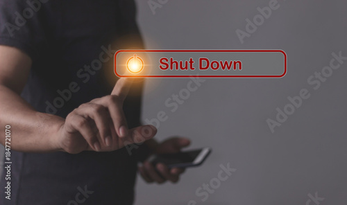 Young man with smartphone hand touching Shut Down button press power OFF