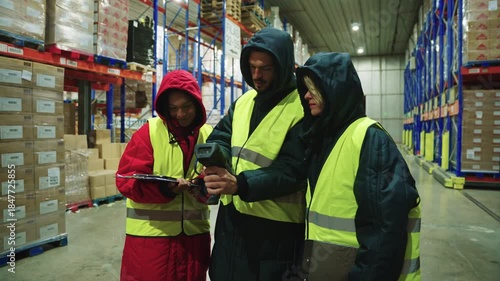 Warehouse workers scanning barcodes in cold storage