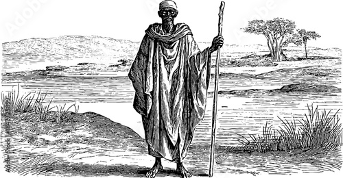 Ancient priest in traditional ceremonial attire with staff