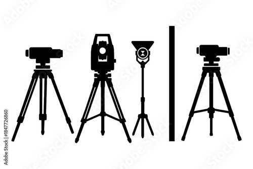 Silhouettes of surveying equipment and tripods in black and white.