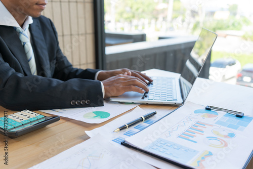 Experienced lawyer providing legal guidance in office, reviewing contracts, documents, finance, justice matters, advising clients during meetings and transactions professionally.