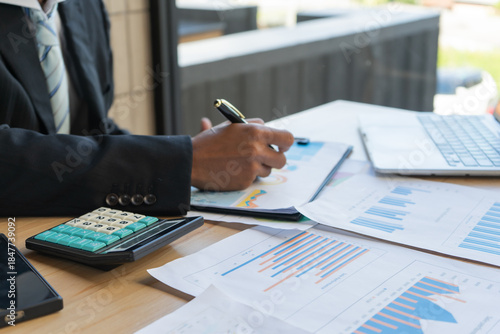 Experienced lawyer providing legal guidance in office, reviewing contracts, documents, finance, justice matters, advising clients during meetings and transactions professionally.