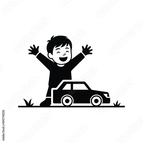 A joyful boy with arms raised stands beside a small toy car