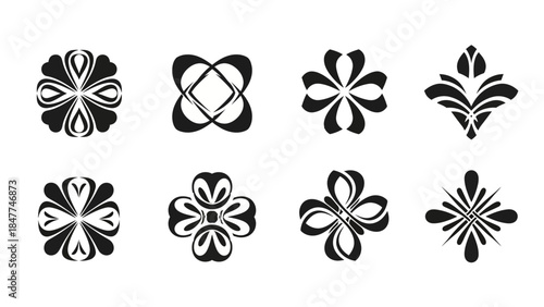 Collection of eight symmetrical black and white floral and ornamental design elements