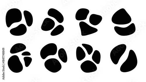 Set of Black Animal Paw Prints Isolated on White Background Vector Art