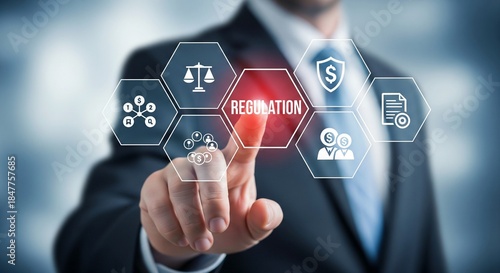 Businessman touches regulation icon with glowing red light