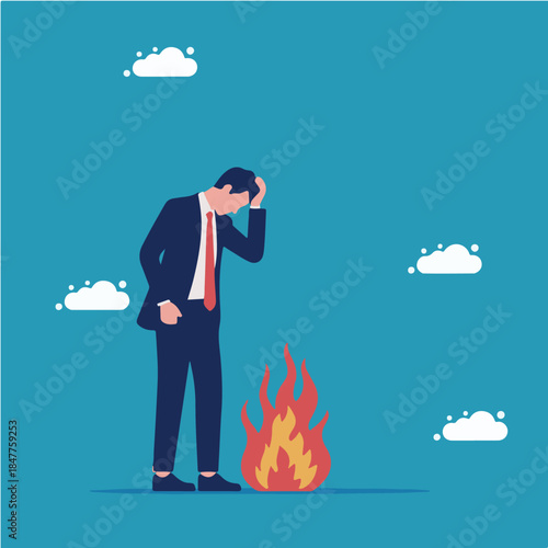 Stressed businessman facing a burning issue or corporate crisis