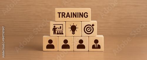 Wooden Blocks with Training Icon Representing Employee Learning and Development Concept