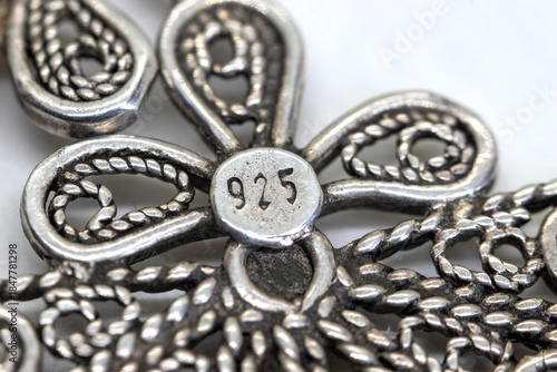 Silver jewelry , 925 silver number sign. White background, filigree