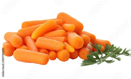 Pile of baby carrots with green leaves on a white background