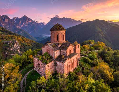 Wallpaper Mural Ancient stone building stands on a hilltop. Green trees and winding paths surround it. Majestic mountains are in the distance Torontodigital.ca