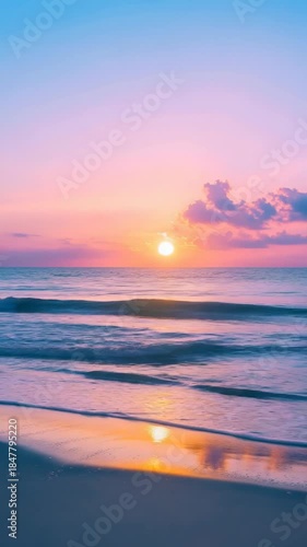 Beautiful sunset over calm ocean waves at a beach resort during the evening