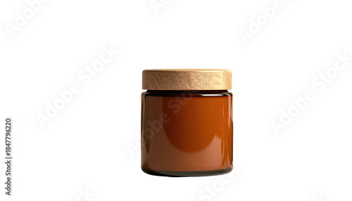 Amber jar with a light wooden lid, set against a stark black background, showcasing minimalist design