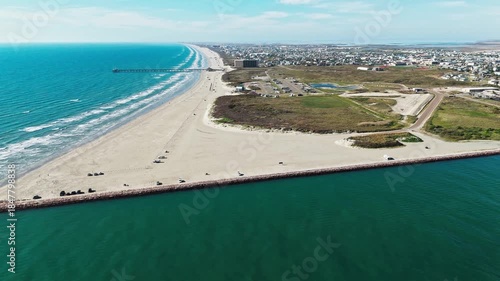Aerial view of the Aransas channel and the Port Aransas Beach park, along the Texas gulf coast on Mustang Island.
