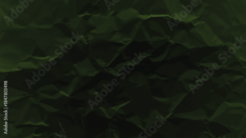 Crumpled dark green paper texture wrinkled