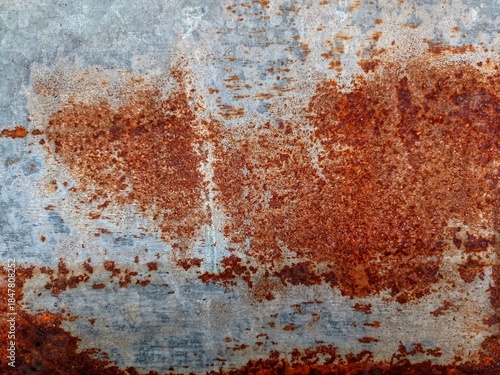 the roof of the house is made of used and rusty zinc