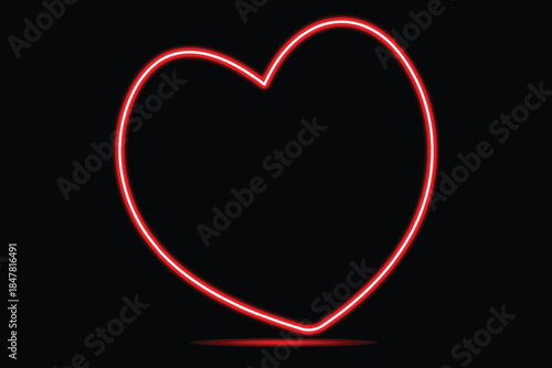A vibrant red neon heart shape glowing brightly against a solid black background, representing love and romance
