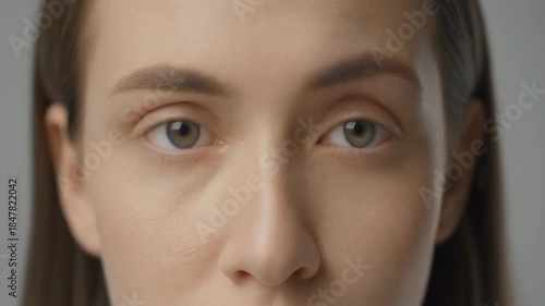Before and after comparison of an adult caucasian woman's eyes with dark circles. Skincare treatment result showing reduction of wrinkles and puffiness for a youthful look