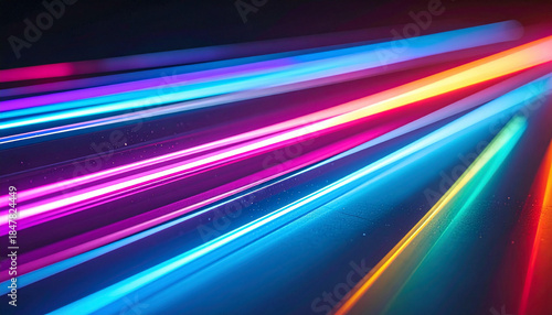 Dynamic abstract background with vibrant colorful light streaks representing speed and technology.