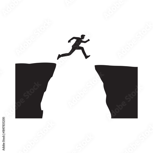 Silhouette of a person leaping across a gap between two dark cliffs