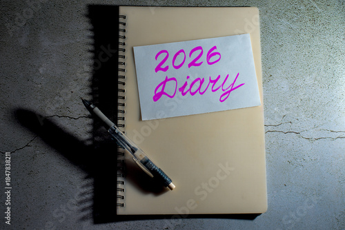 A notebook with '2026 Diary' handwritten and a pen.