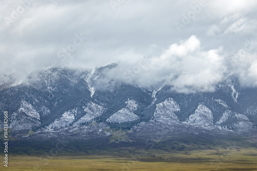 Snow trail on distant mountain range peaks