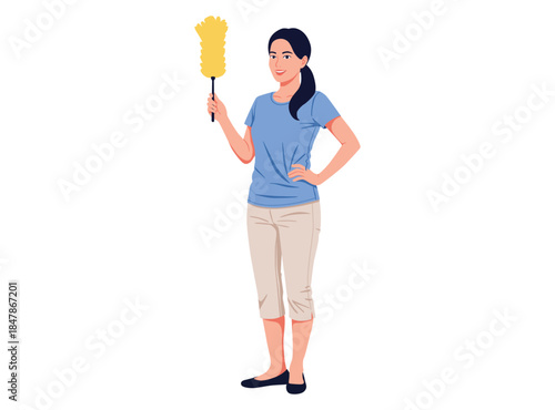 smiling woman stands holding feather duster, ready for cleaning or household chores