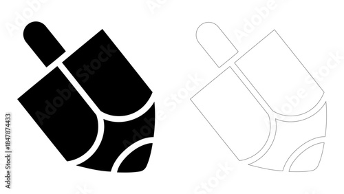 A black dreidel, a traditional spinning game piece for festivals
