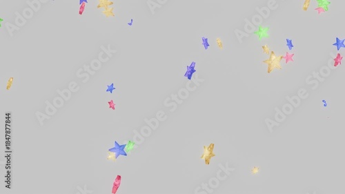 回転しながら落下するたくさんのカラフルな星