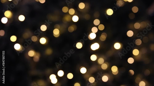 Flashing yellow Christmas lights and bokeh from the blur.