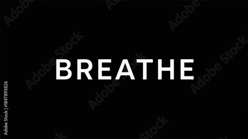 Simple, bold text "BREATHE" on a dark background, conveying a message of calm and mindfulness.